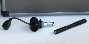 A flashlight and lightbulb on a table